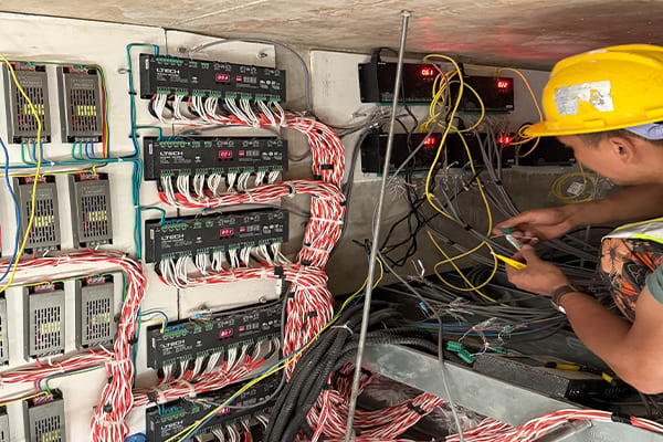 Engineer checking a DMX control panel for an architectural lighting system